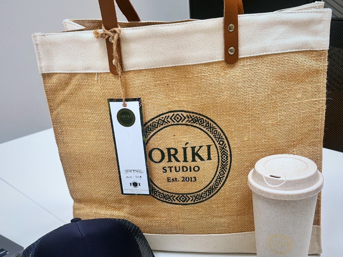 Oríki Studio branded jute tote, reusable cup and cap